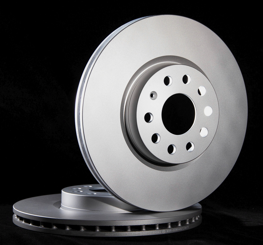Car brake discs on a black background, isolate. Disc brake system, effective braking, close-up
